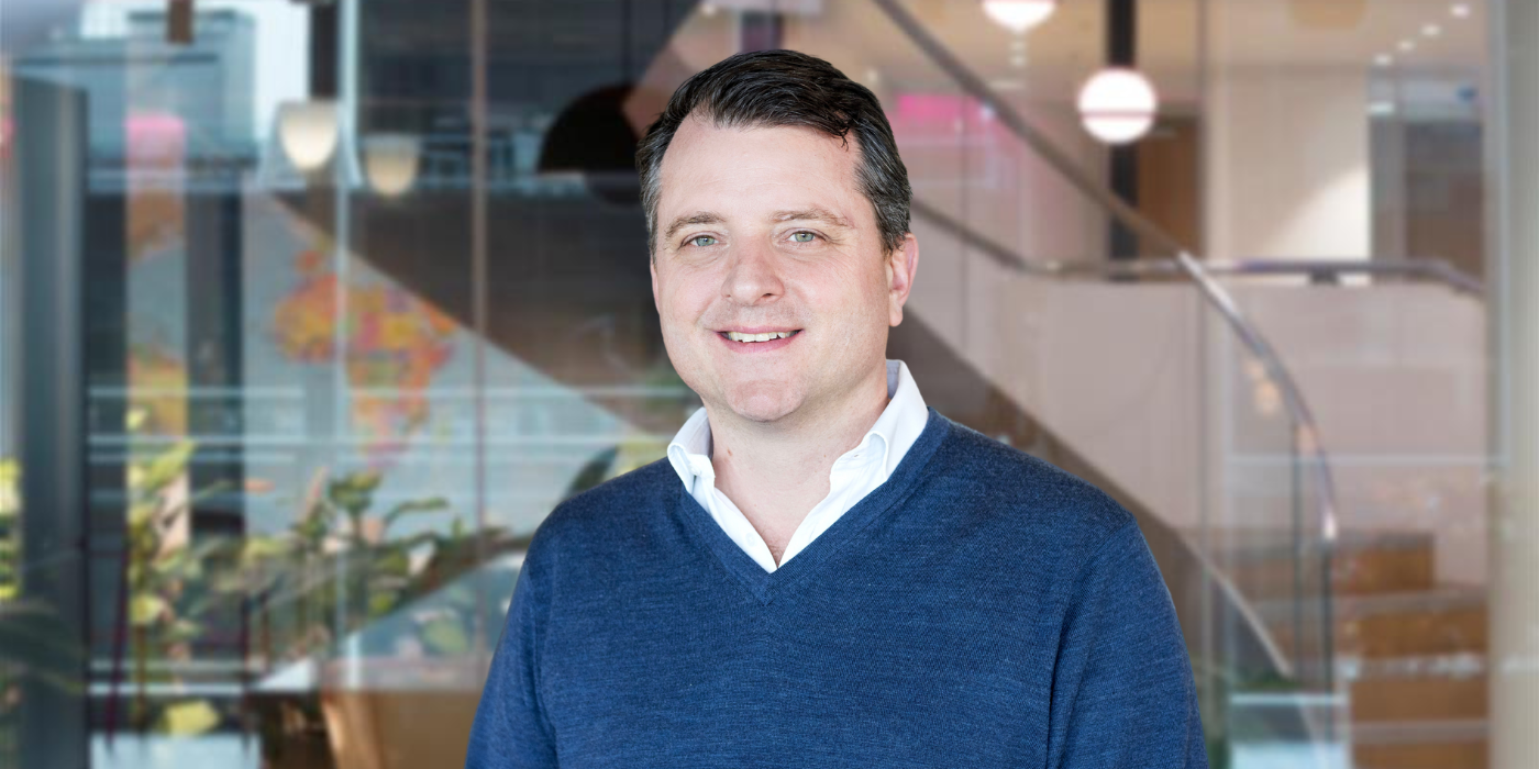 A professional headshot of Gregory Borel