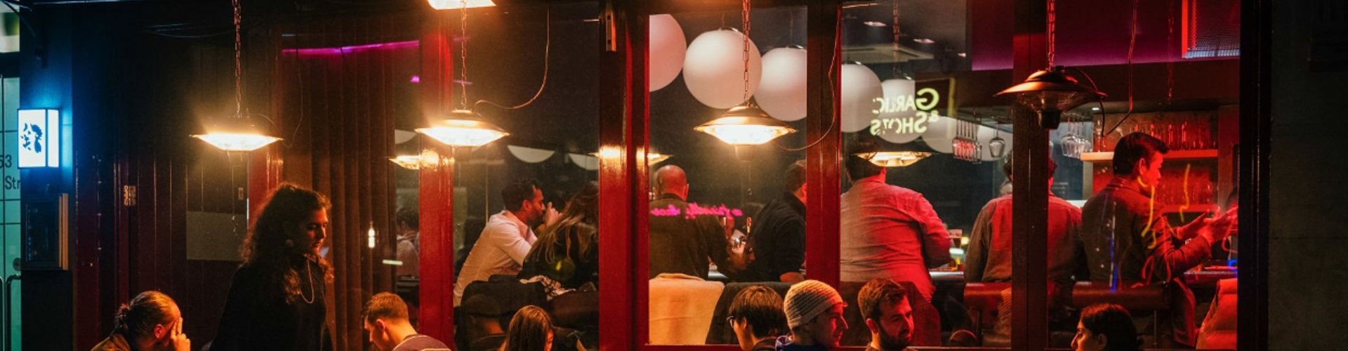 People sitting in a bar restaurant at night