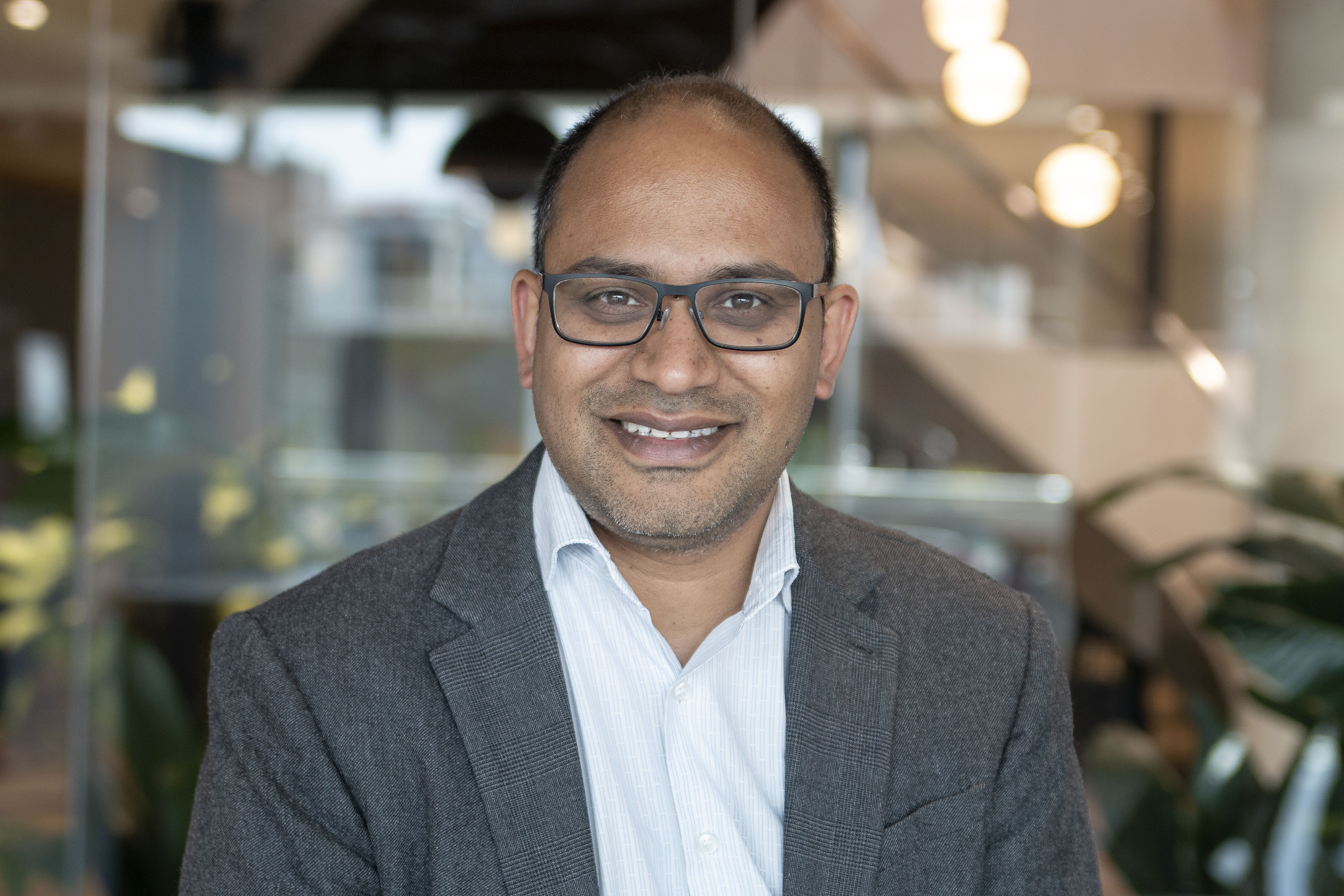 A professional headshot of Shamil Shah