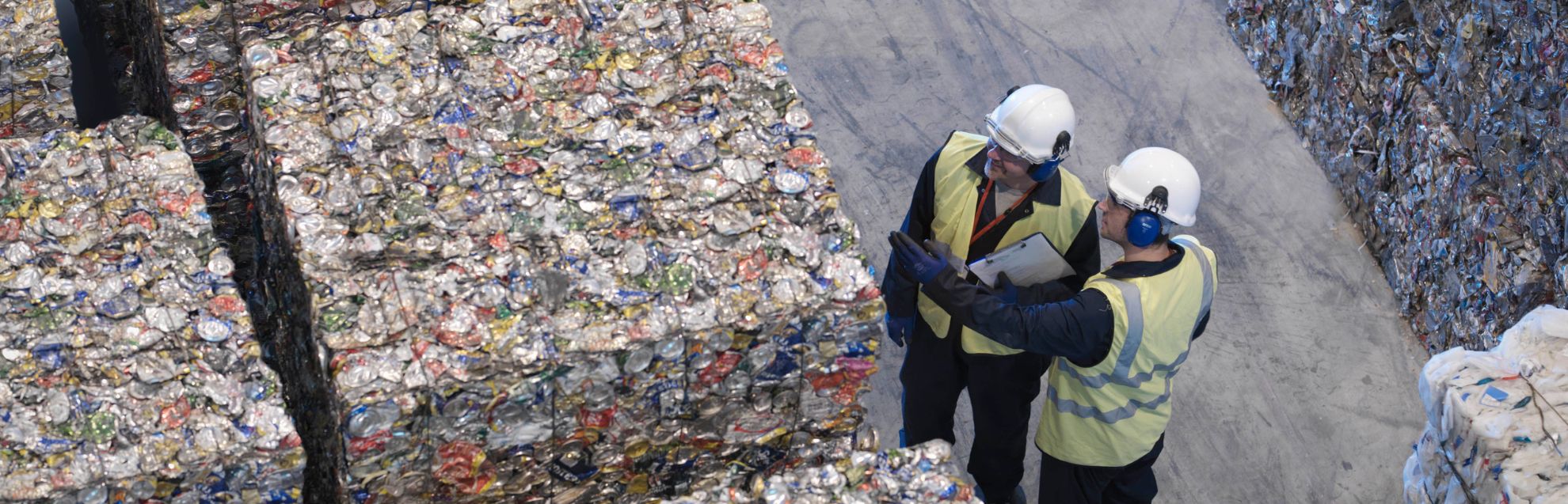 Workers With Bales Of Tin Cans 