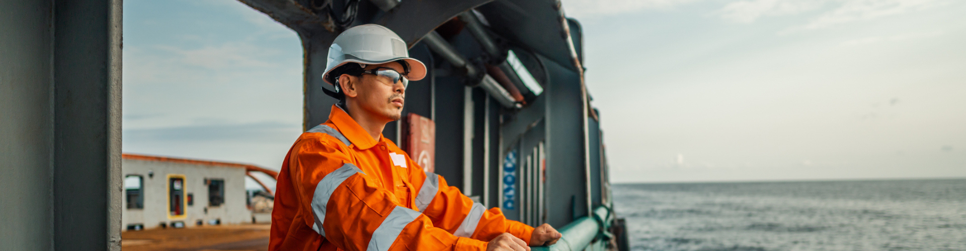 Worker looking towards the sea
