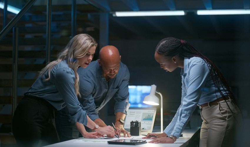 Three people working on a project