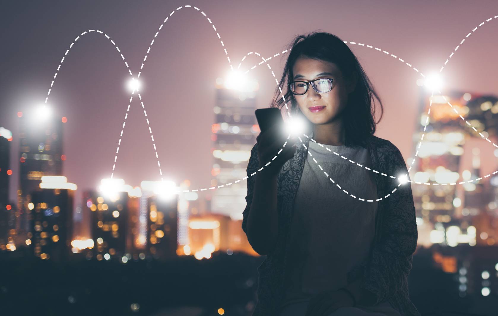 A woman with her phone and graphical overlay