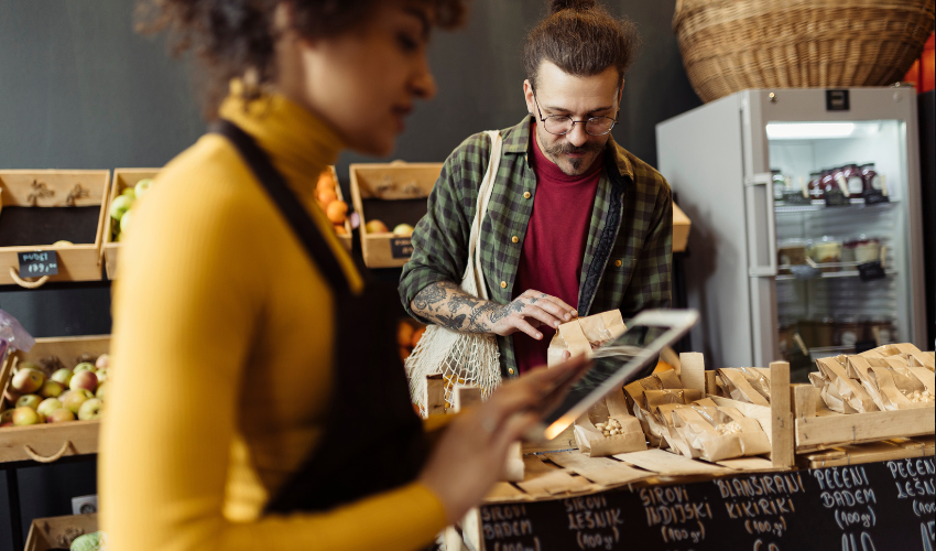 Shop assistant and customer in a food store