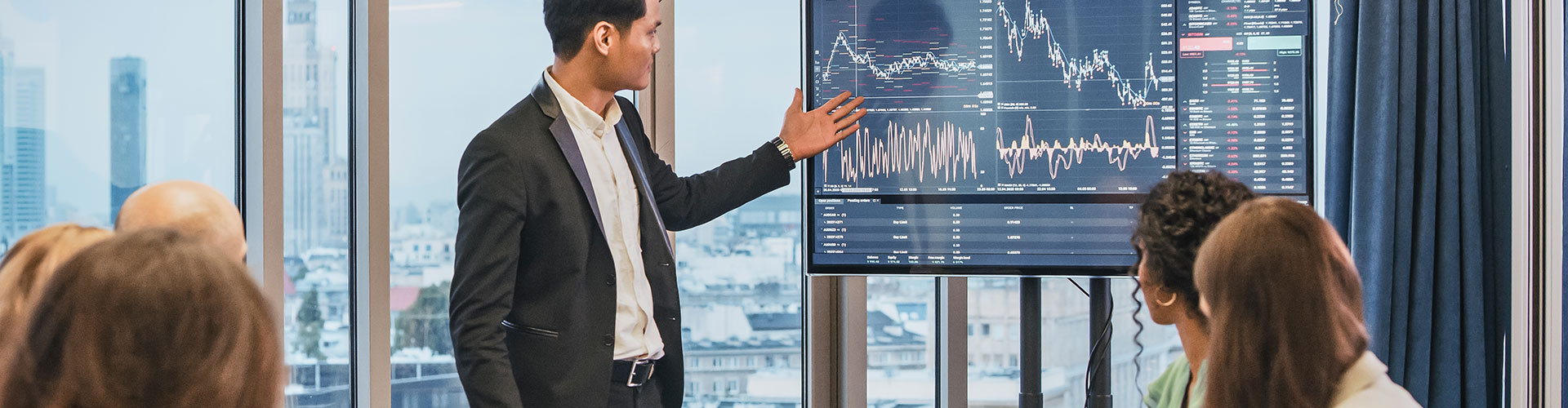 Group of people in a business meeting analysing data