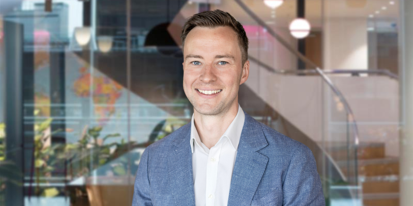 A professional headshot of Toby Thornton