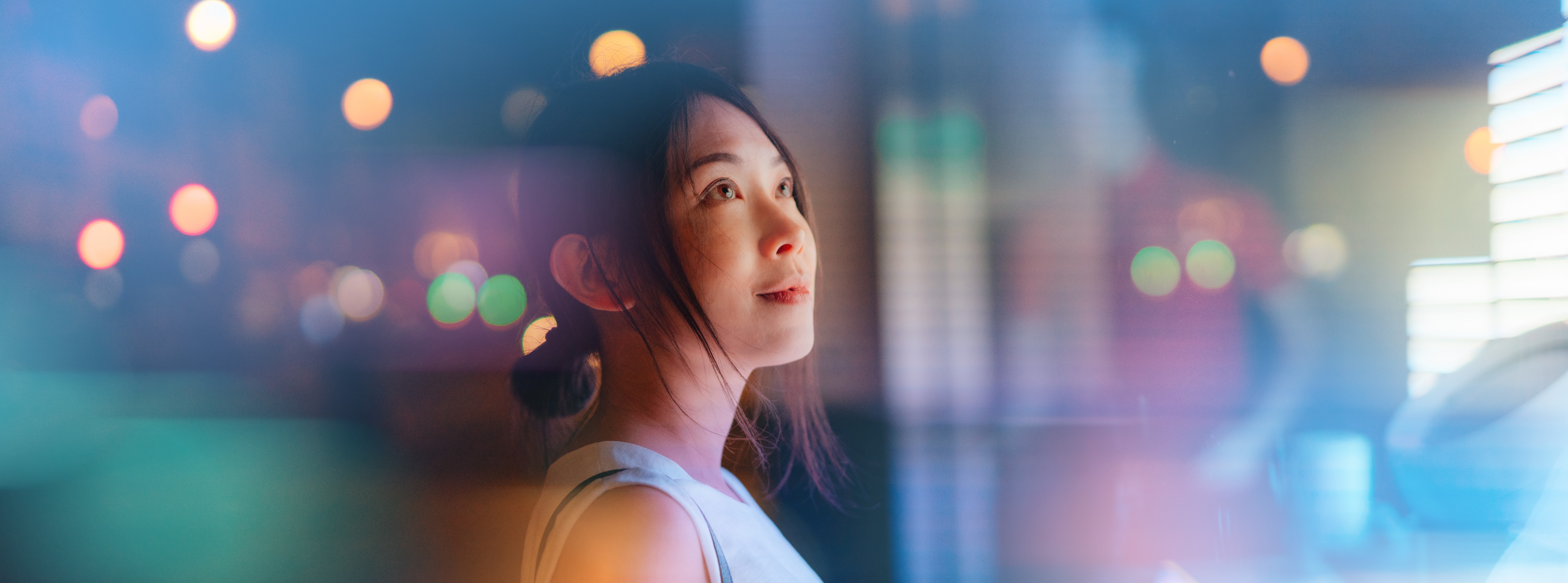 Young woman looking at futuristic digital display