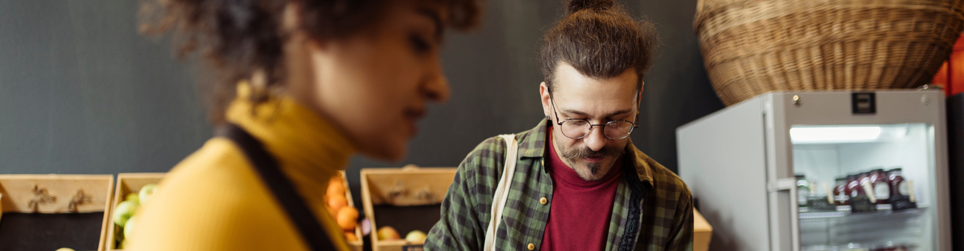 Shop assistant and shopper in a food store