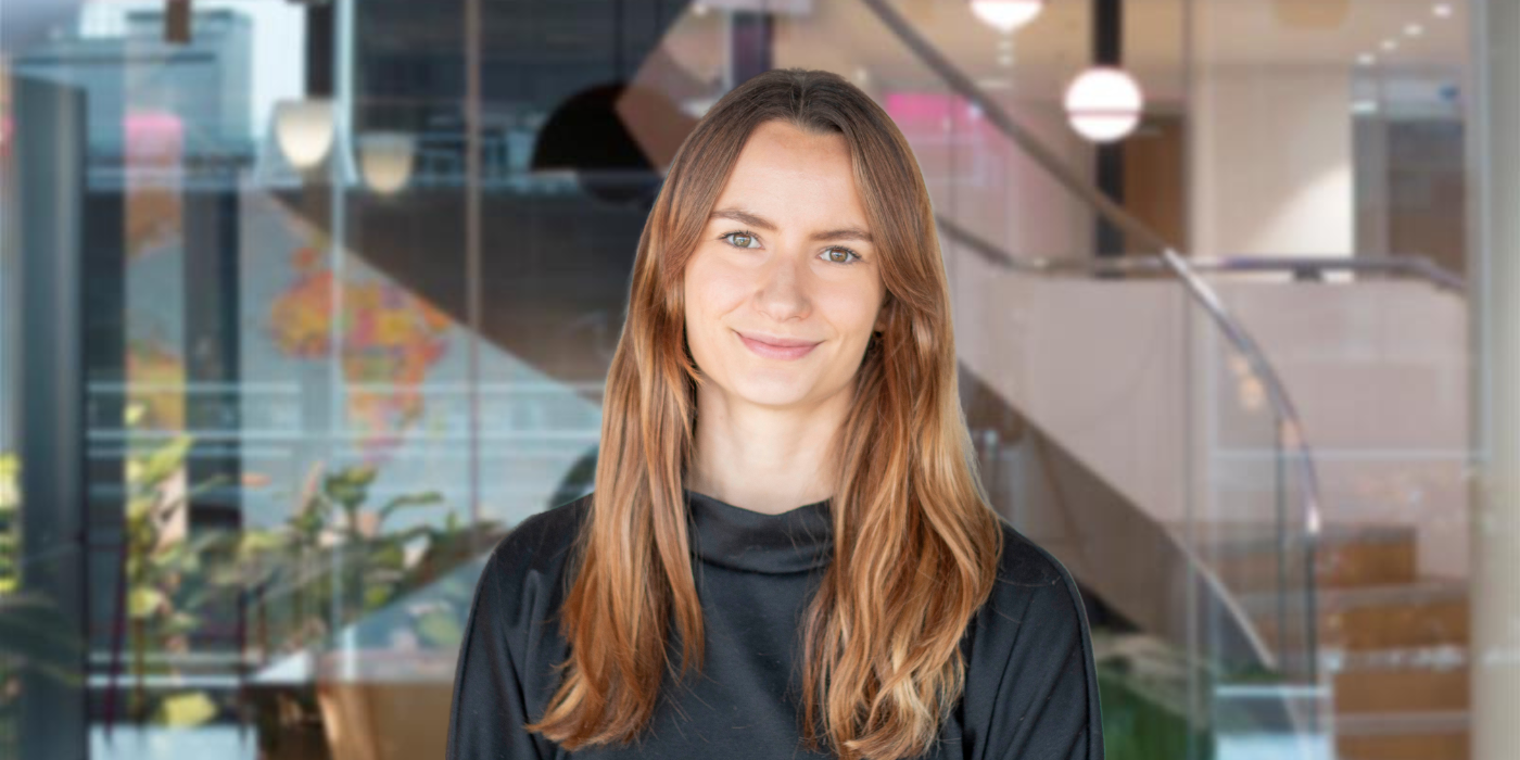 A professional headshot of Laura Menzies