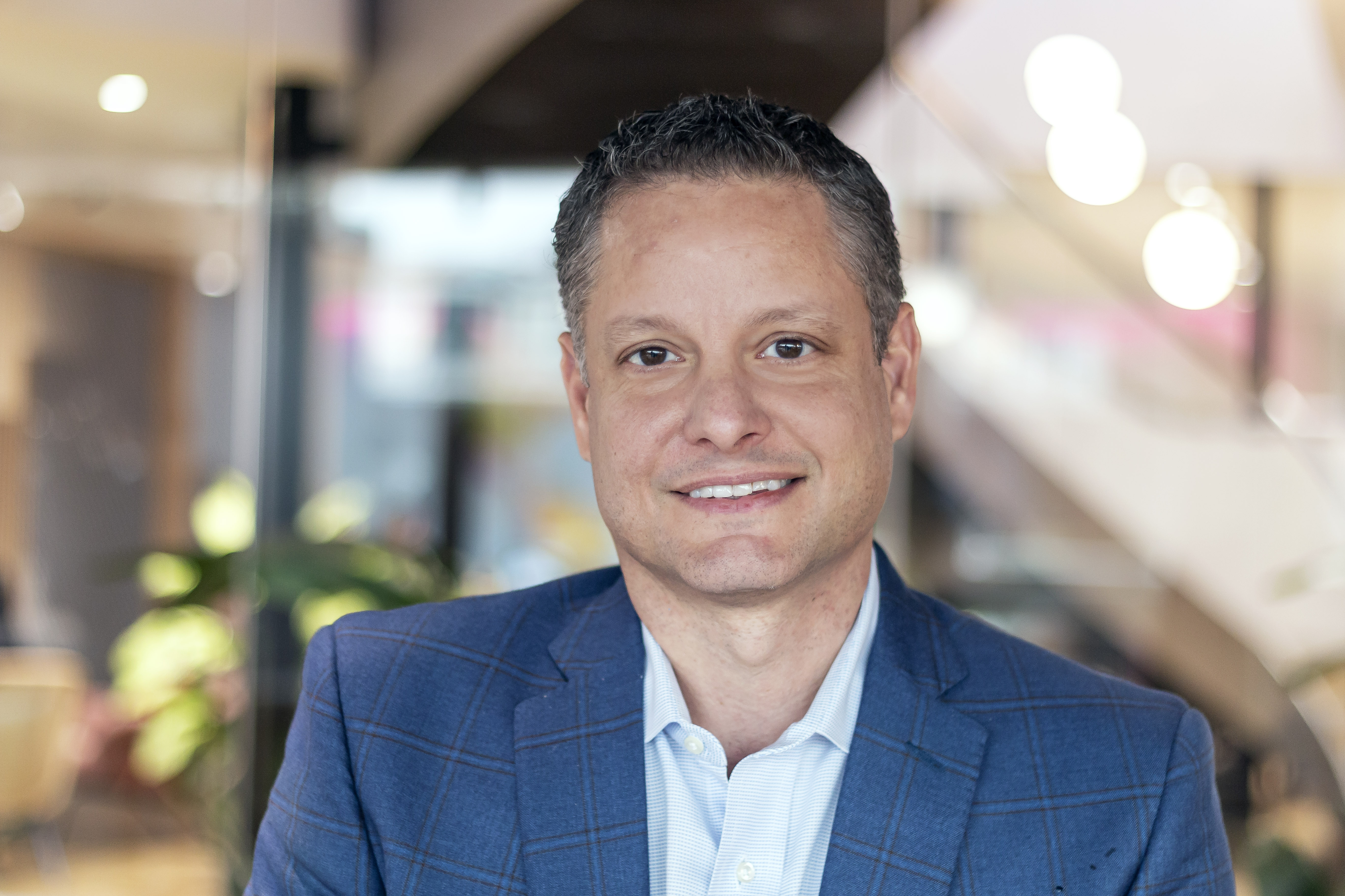 A professional headshot of Baris Ertan