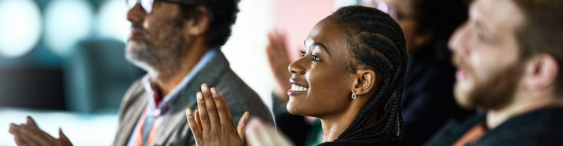 Group of people clapping their hands