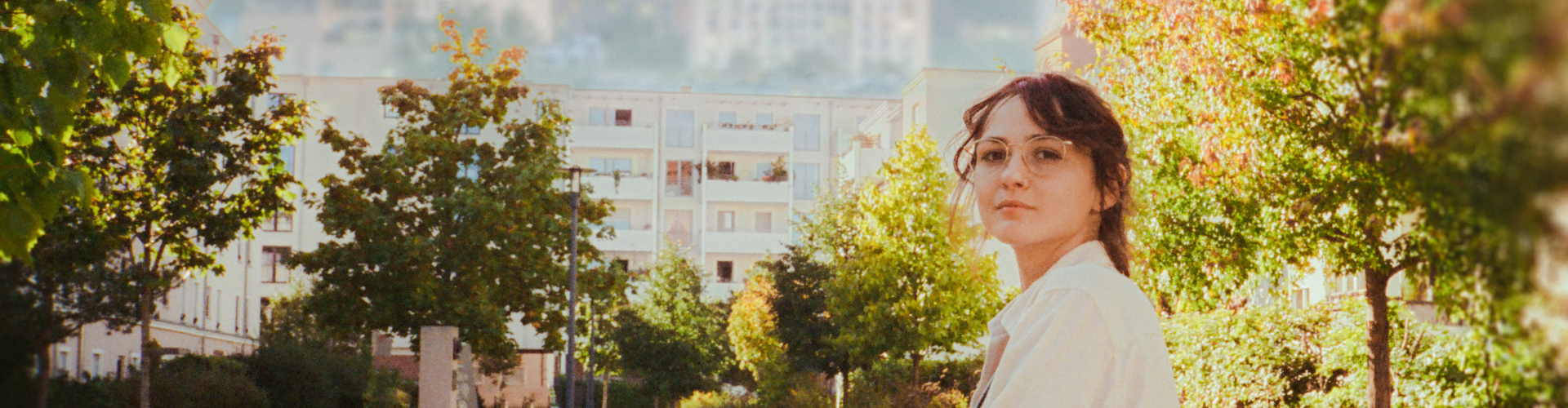 Woman in a leafy neighbourhood