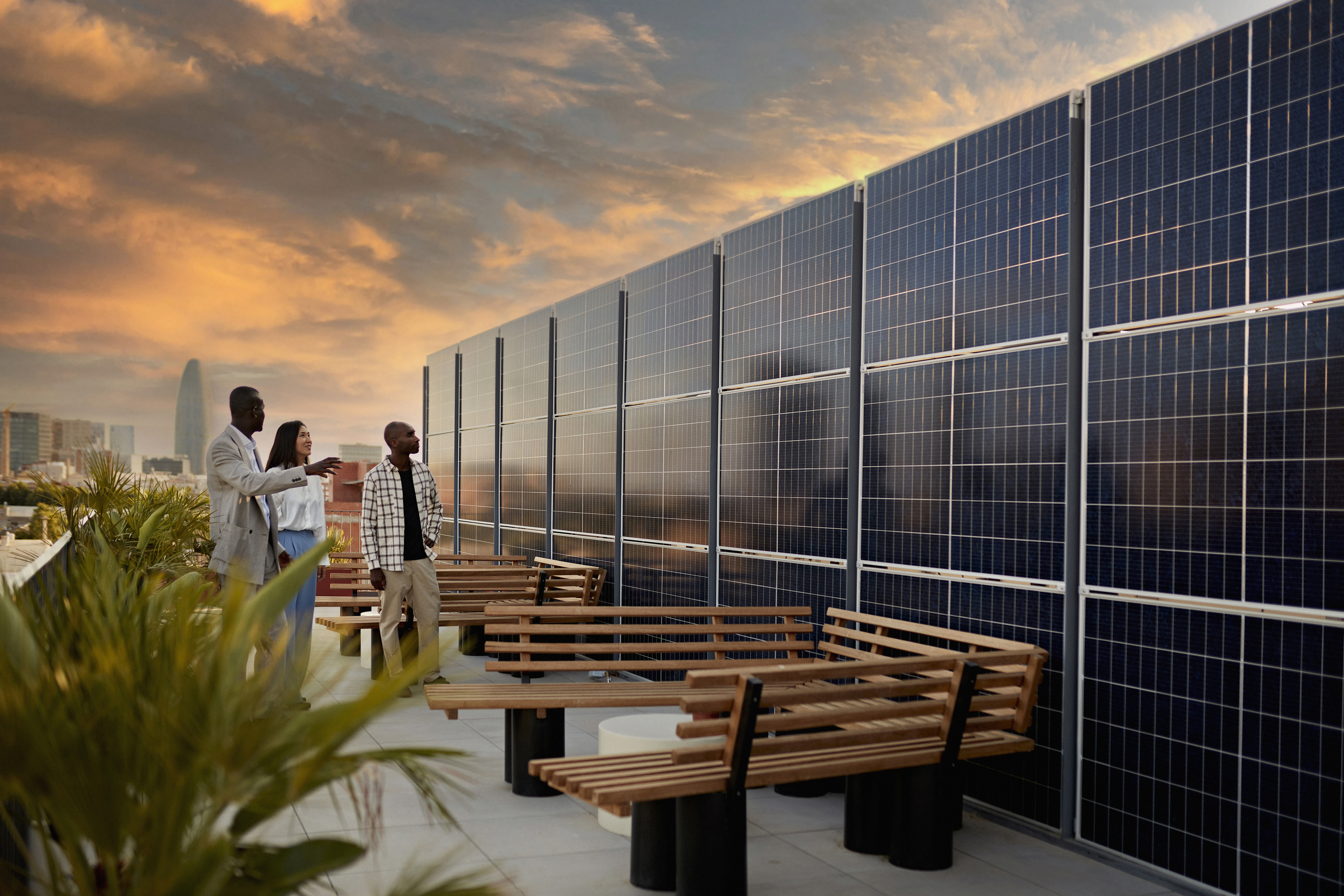 Prospective Buyers Admiring Solar Energy System on a city rooftop