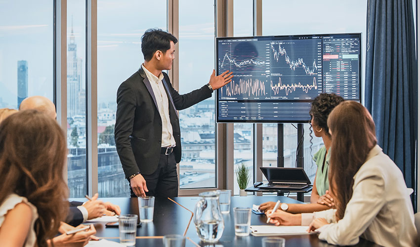 Group of people in a business meeting analysing data
