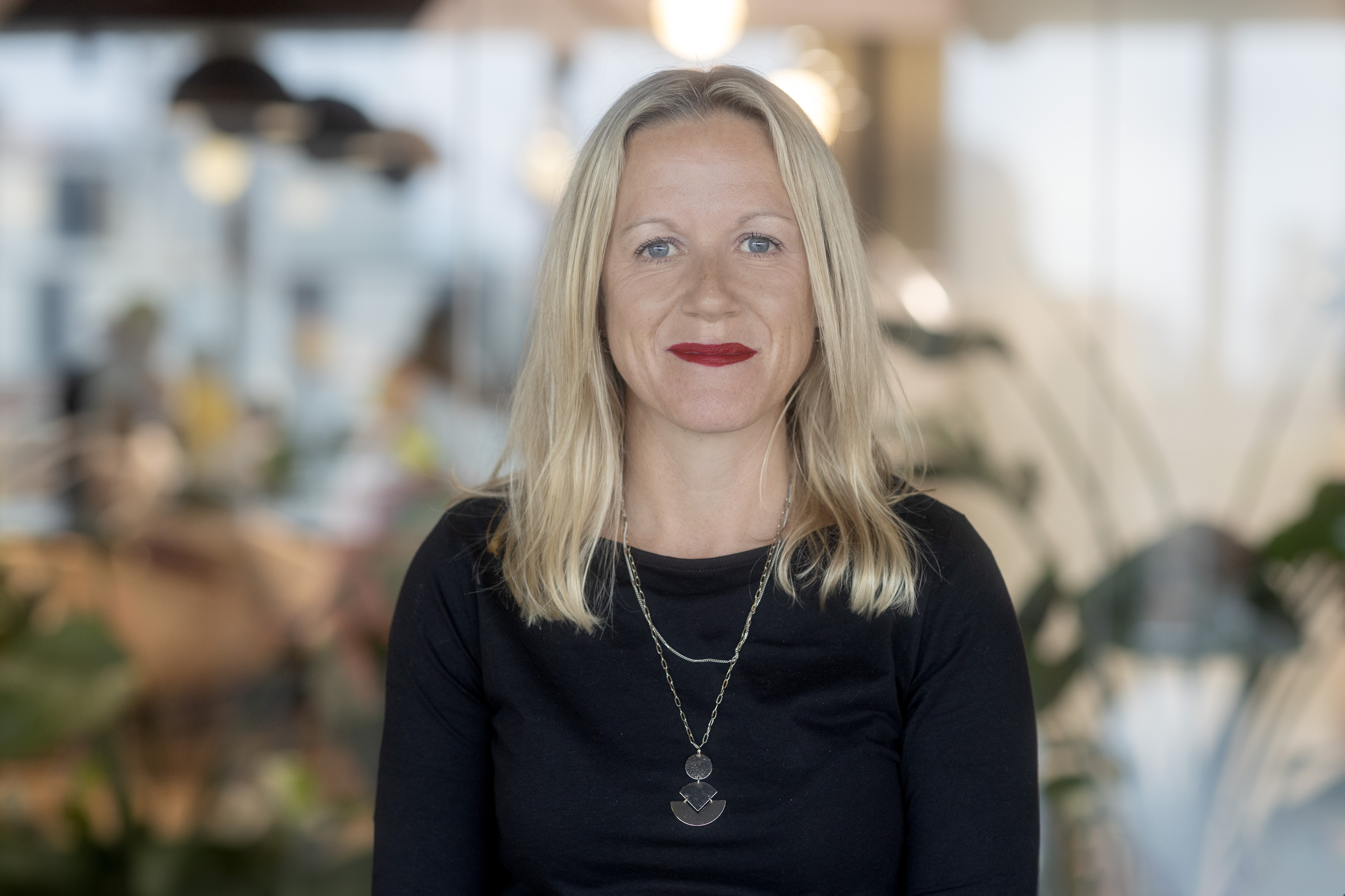 A professional headshot of Ellie Wilkes