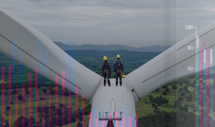 Two workers on top of a wind turbine