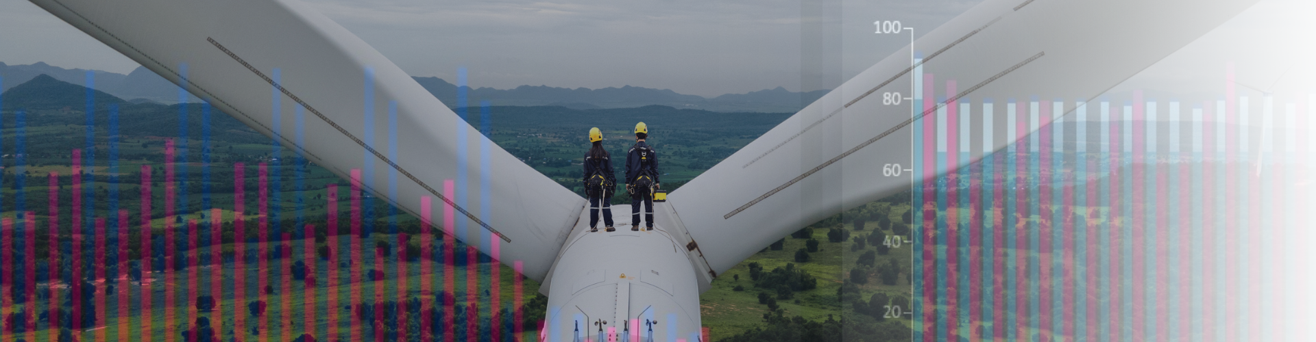 Two workers on top of a wind turbine