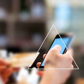 Looking a triangle to see a phone with rest of the image blurred