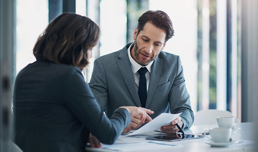 Two business people reviewing a document