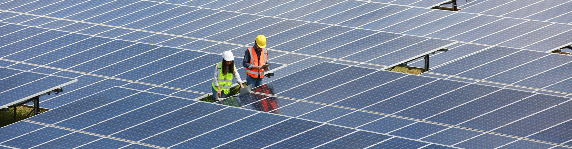 Workers working on solar panels