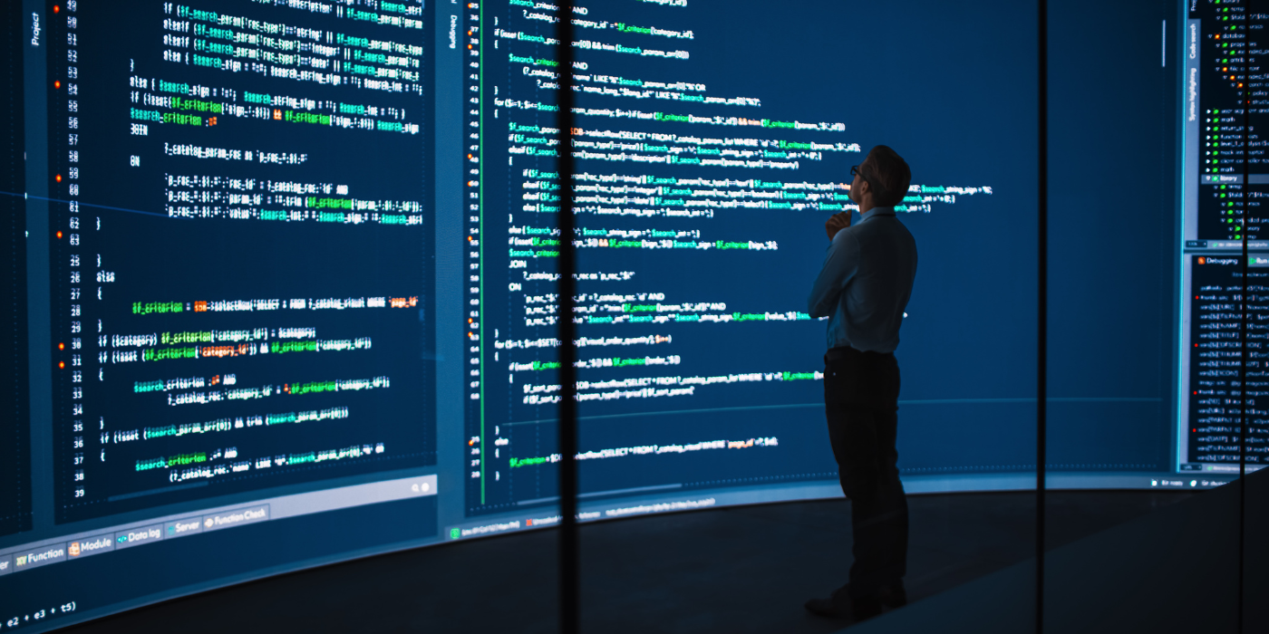 Business man computer screen coding