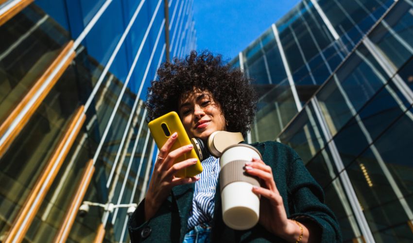 Lady smiling at her mobile phone