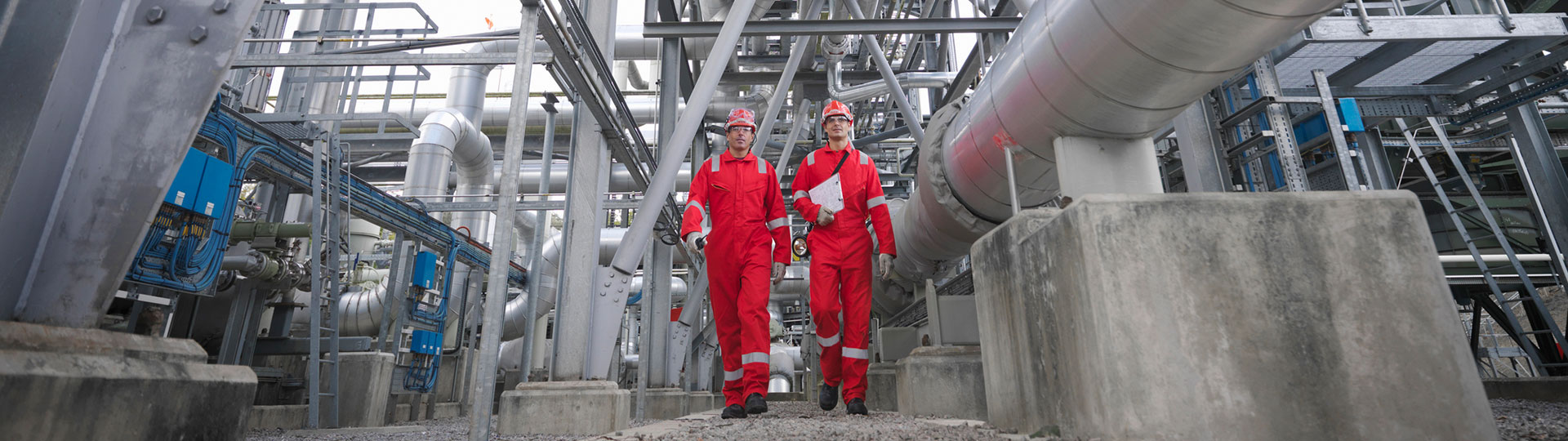 Two workers in an energy facility