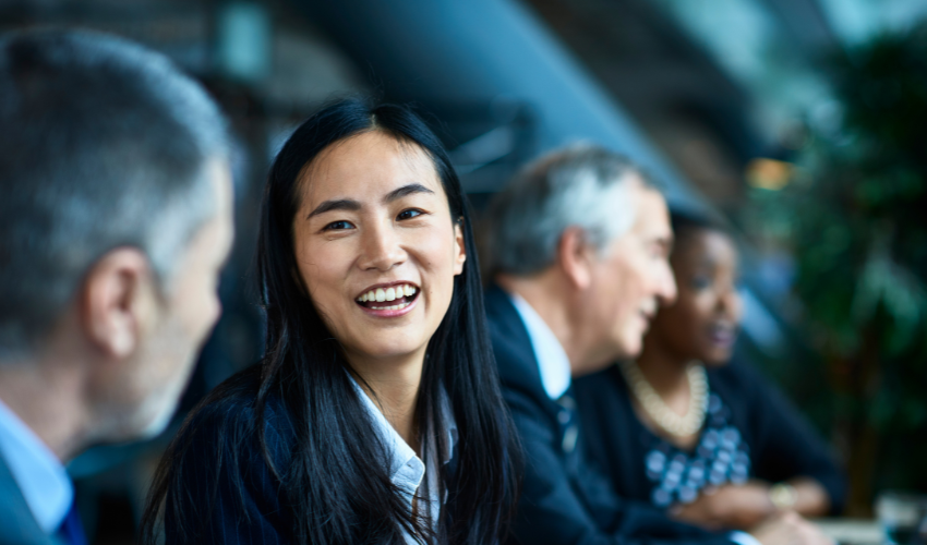 Woman smiling next to man