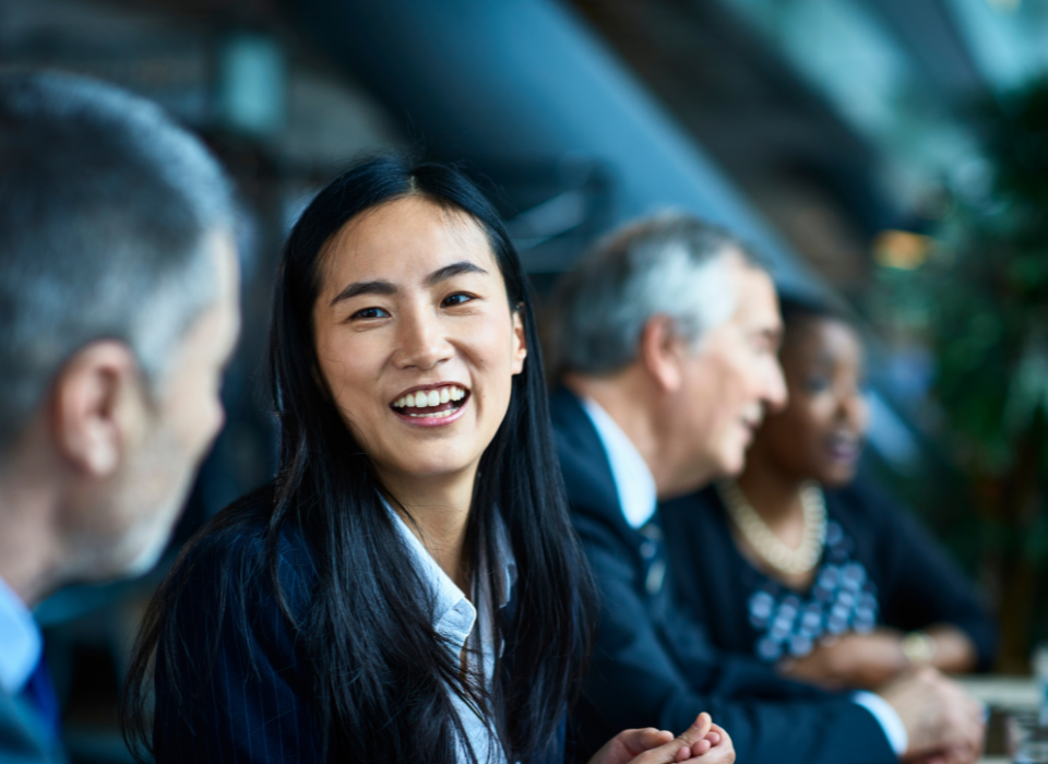 Woman smiling next to man