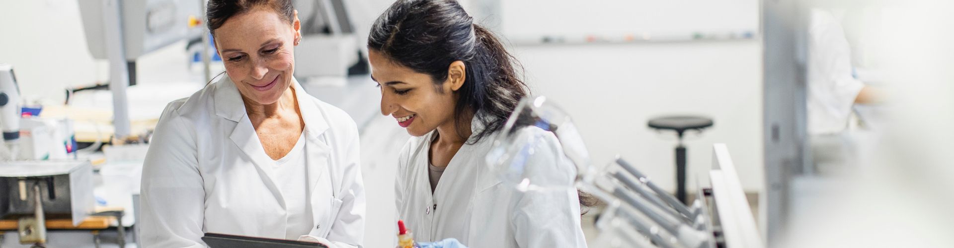 Two people in lab coats