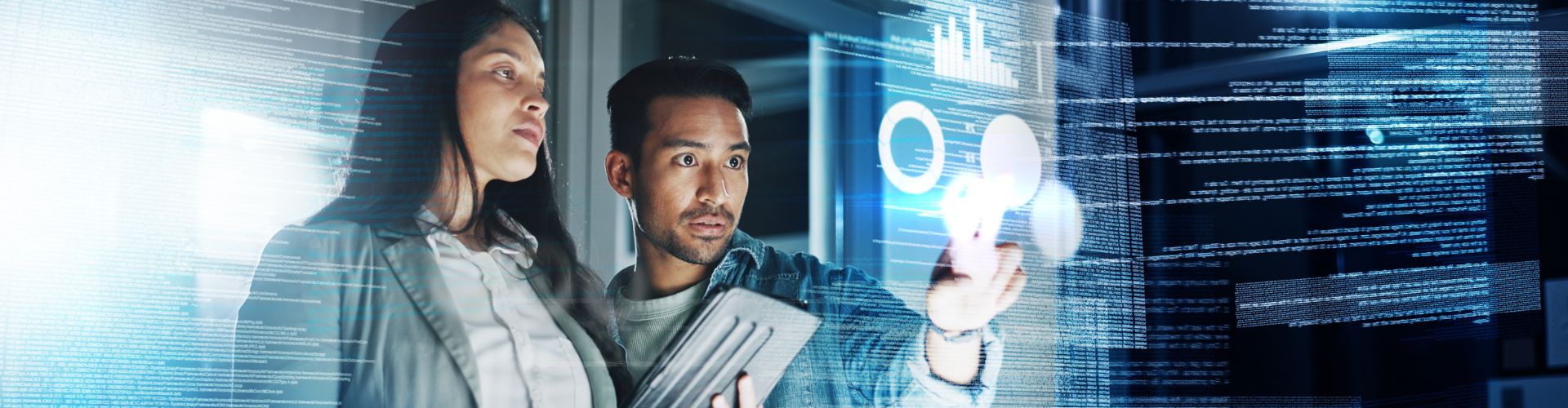 Two people reviewing information on a screen