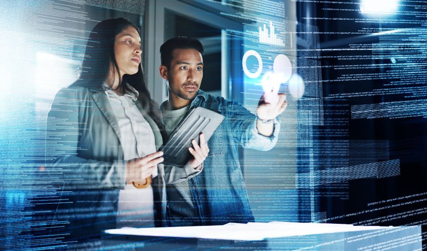 Two people reviewing information on a screen