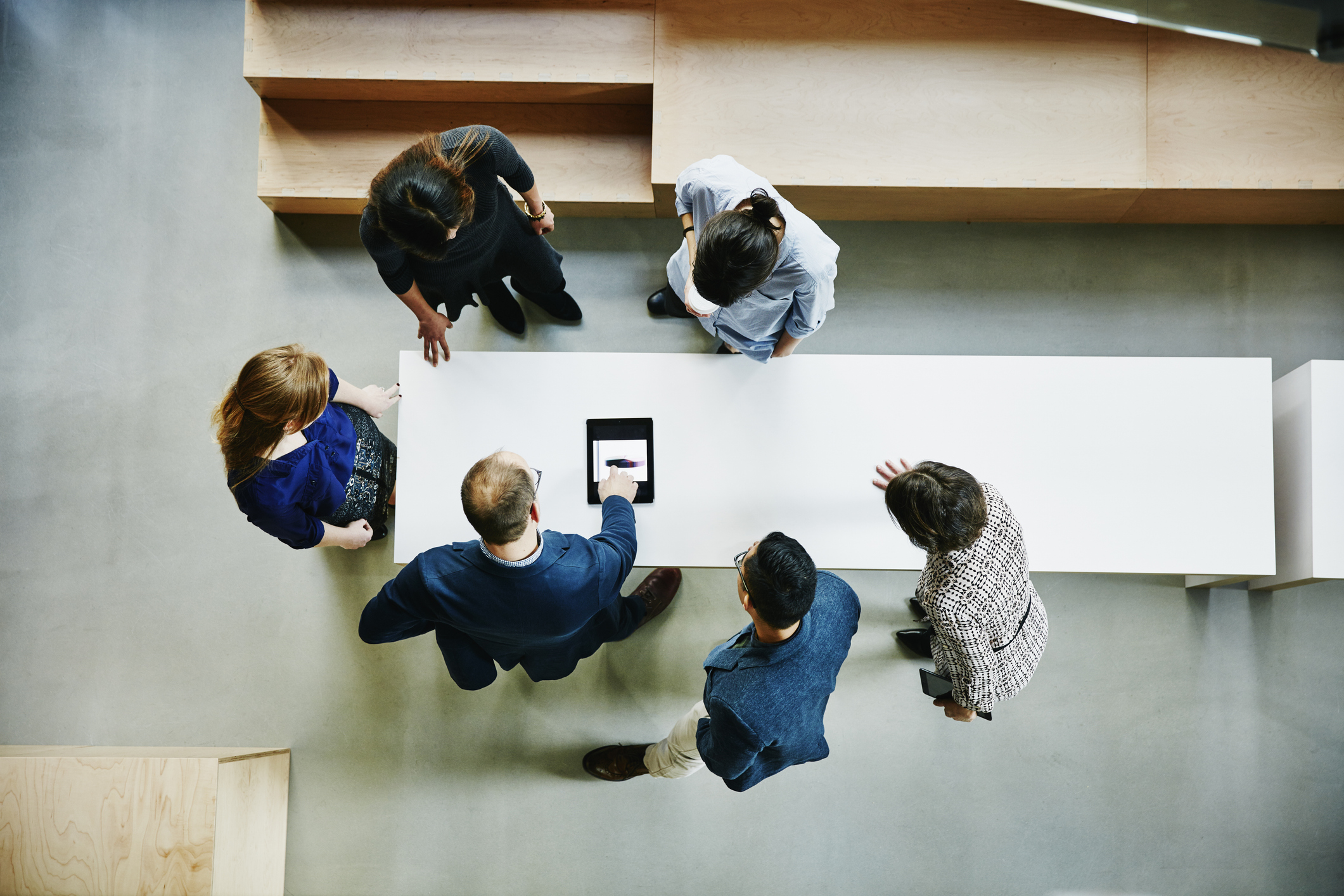 Work team looking at a tablet
