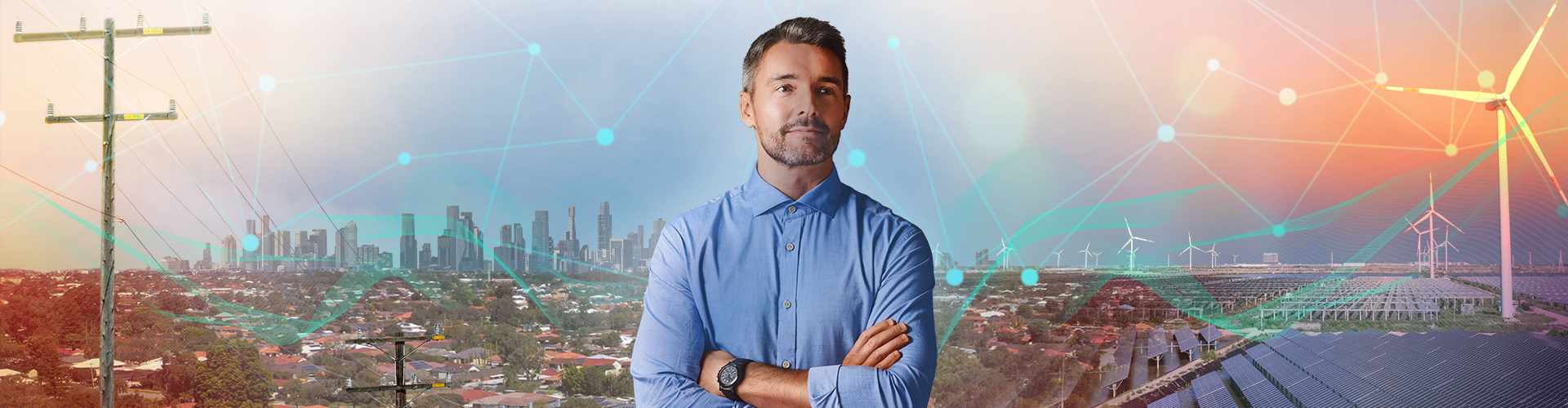 Man in front of a landscape with electric poles and wind turbines