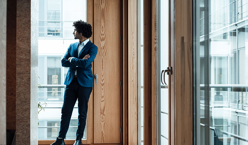 Standing man by the window