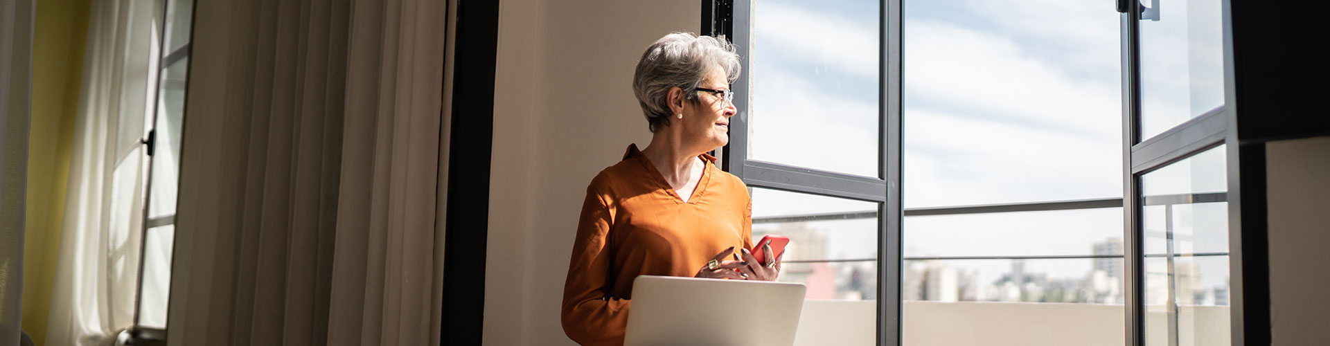 Woman looking out of a window