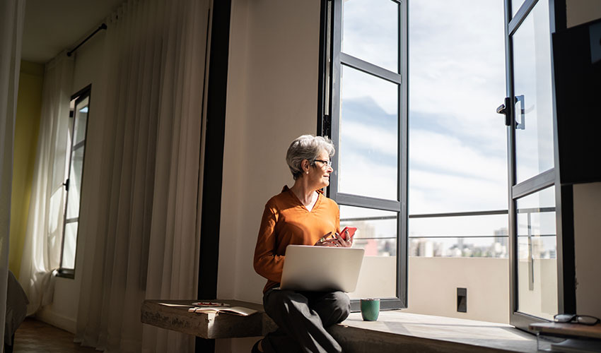 Woman looking out of a window