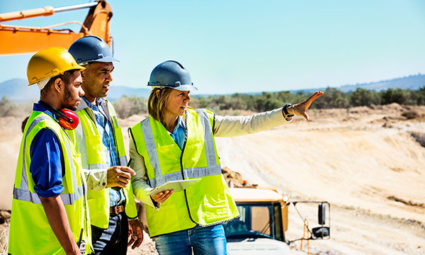 Team of workers inspecting a mine