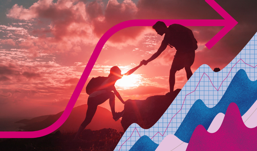 Two people scaling cliff