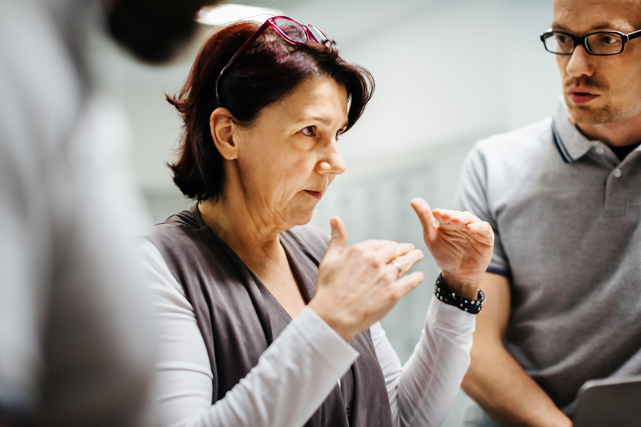 Woman in a meeting giving an explanation