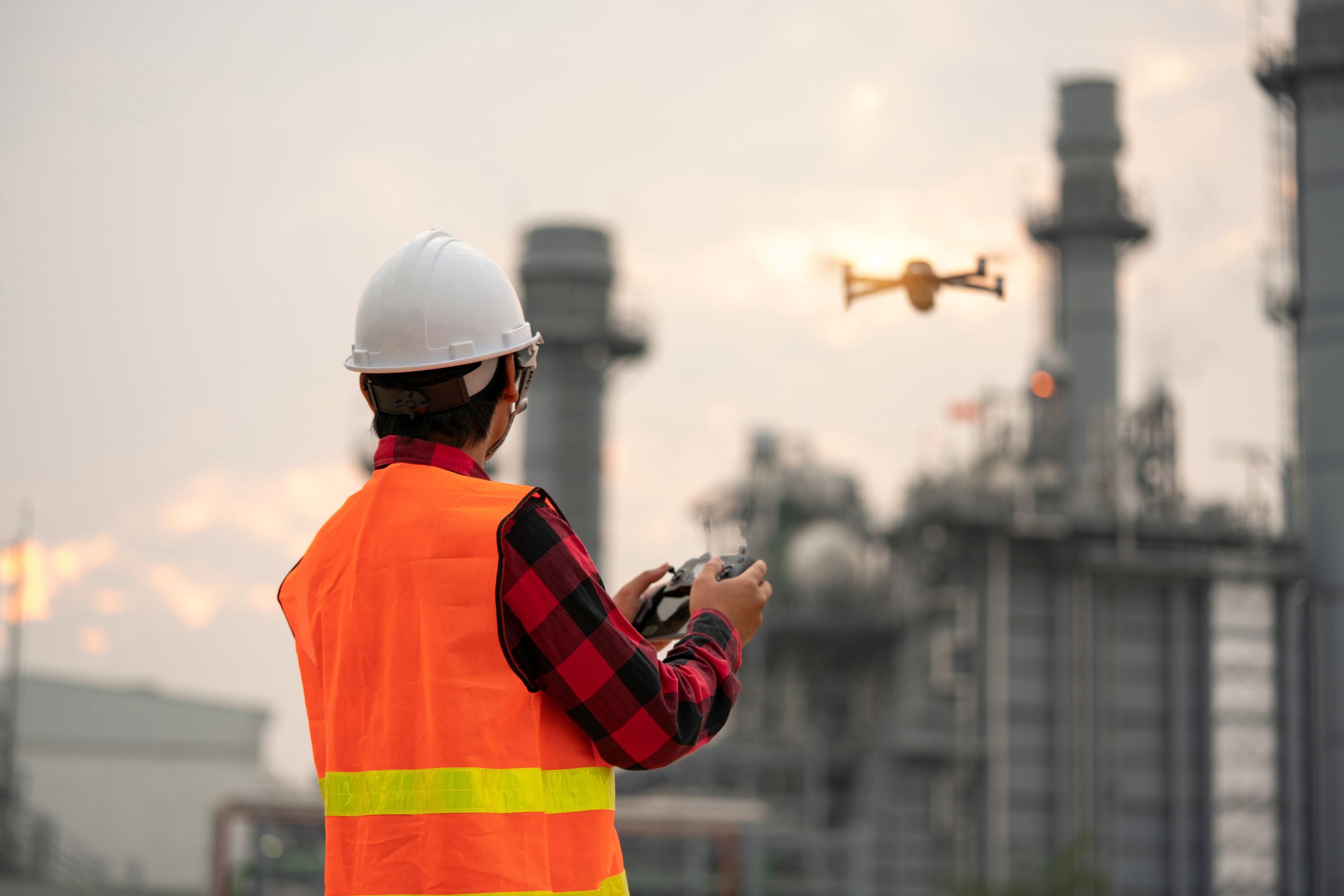 Worker piloting a drone
