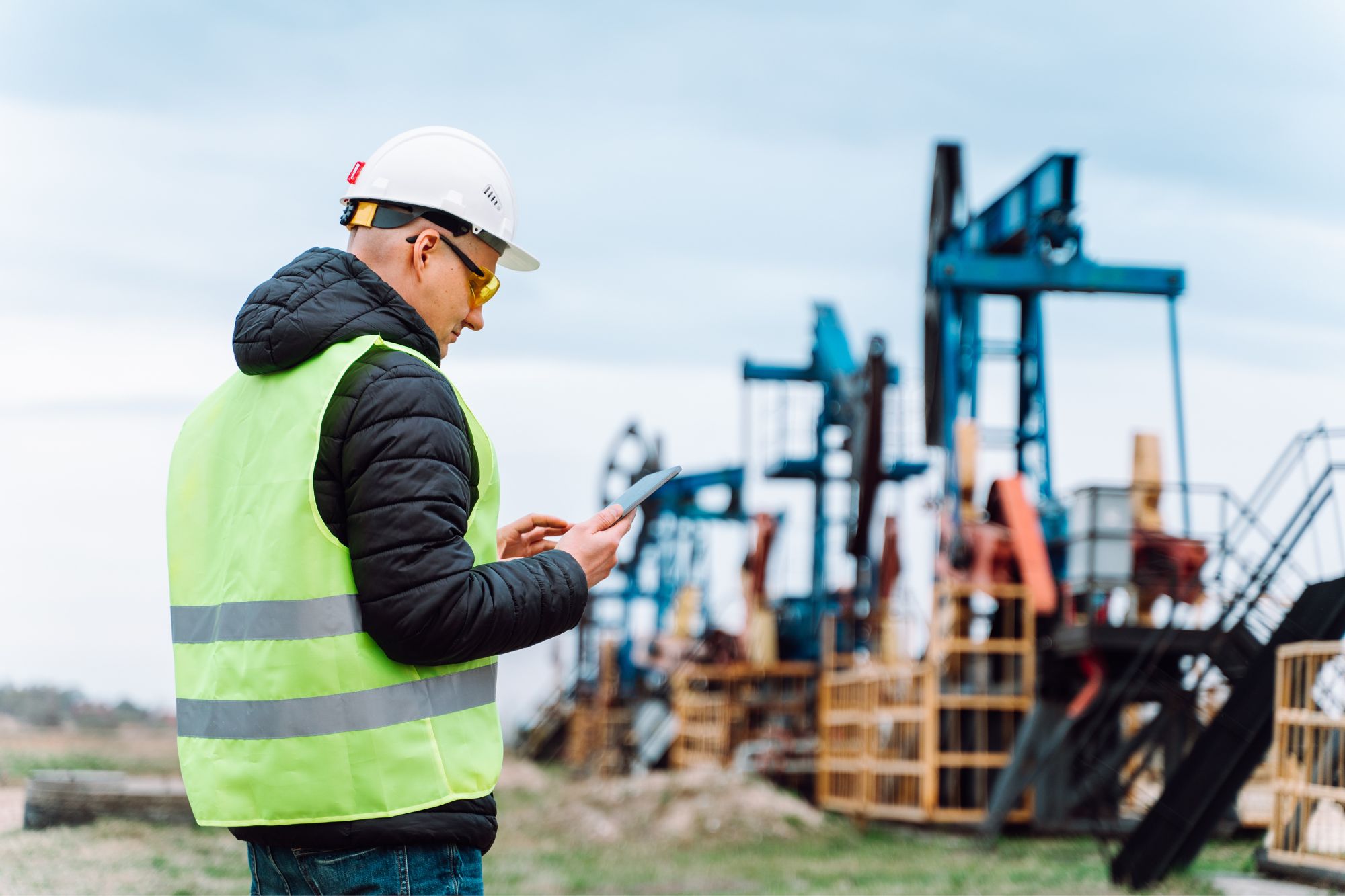 Worker inspecting an oil extraction site