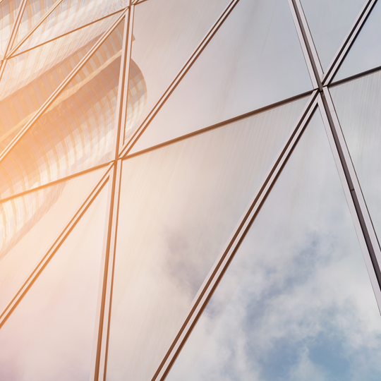 Skyscrapers reflected in triangular glass windows