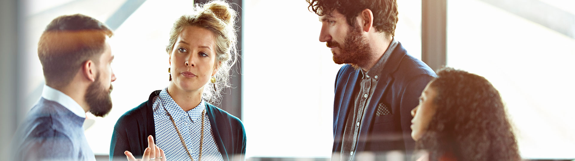 Four people having a conversation