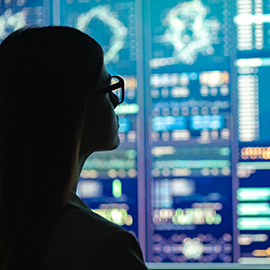 Woman looking at digital screens