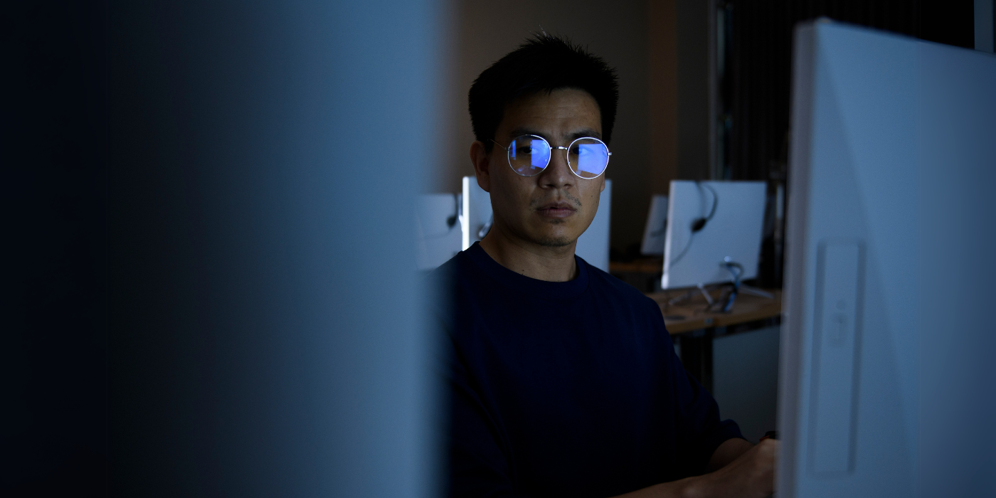 Computer hacker stealing information with computer