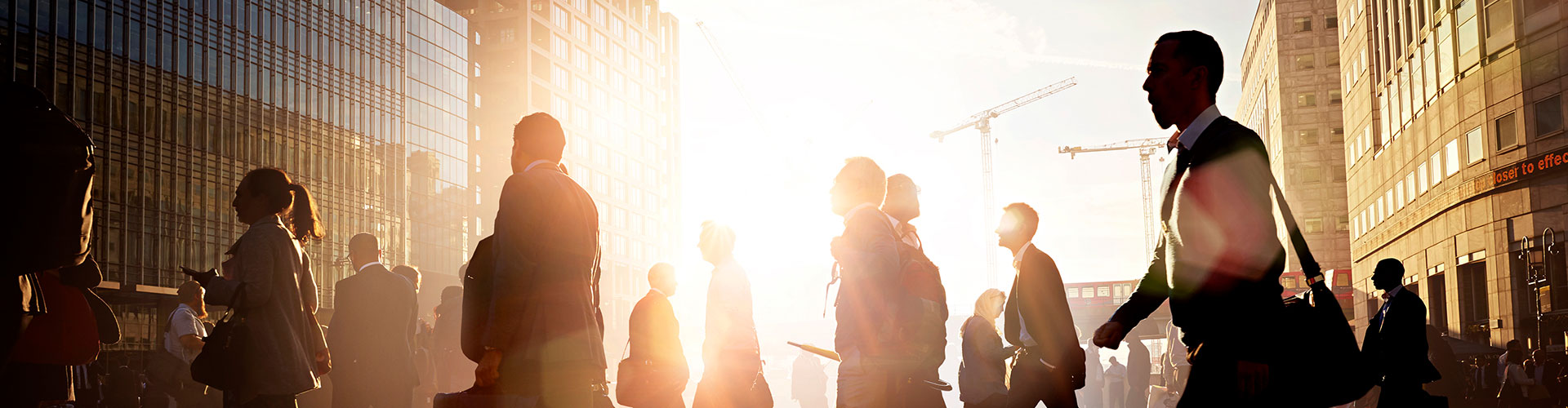 Business people crossing the road in a busy city