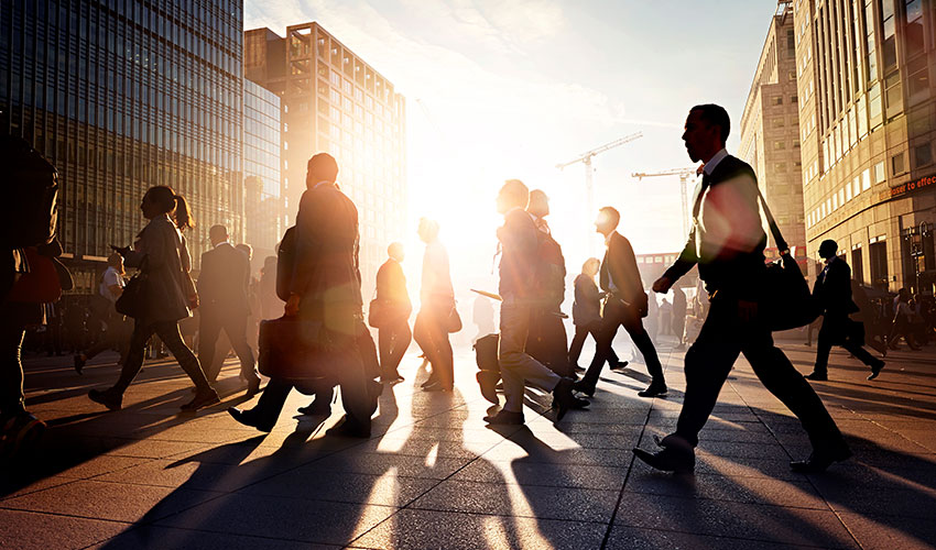 Business people crossing the road in a busy city