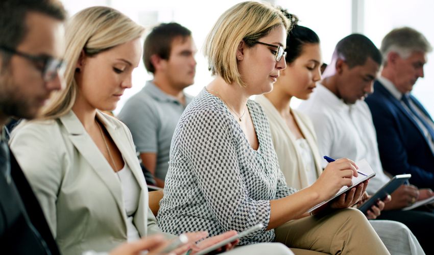 Group of professionals taking notes