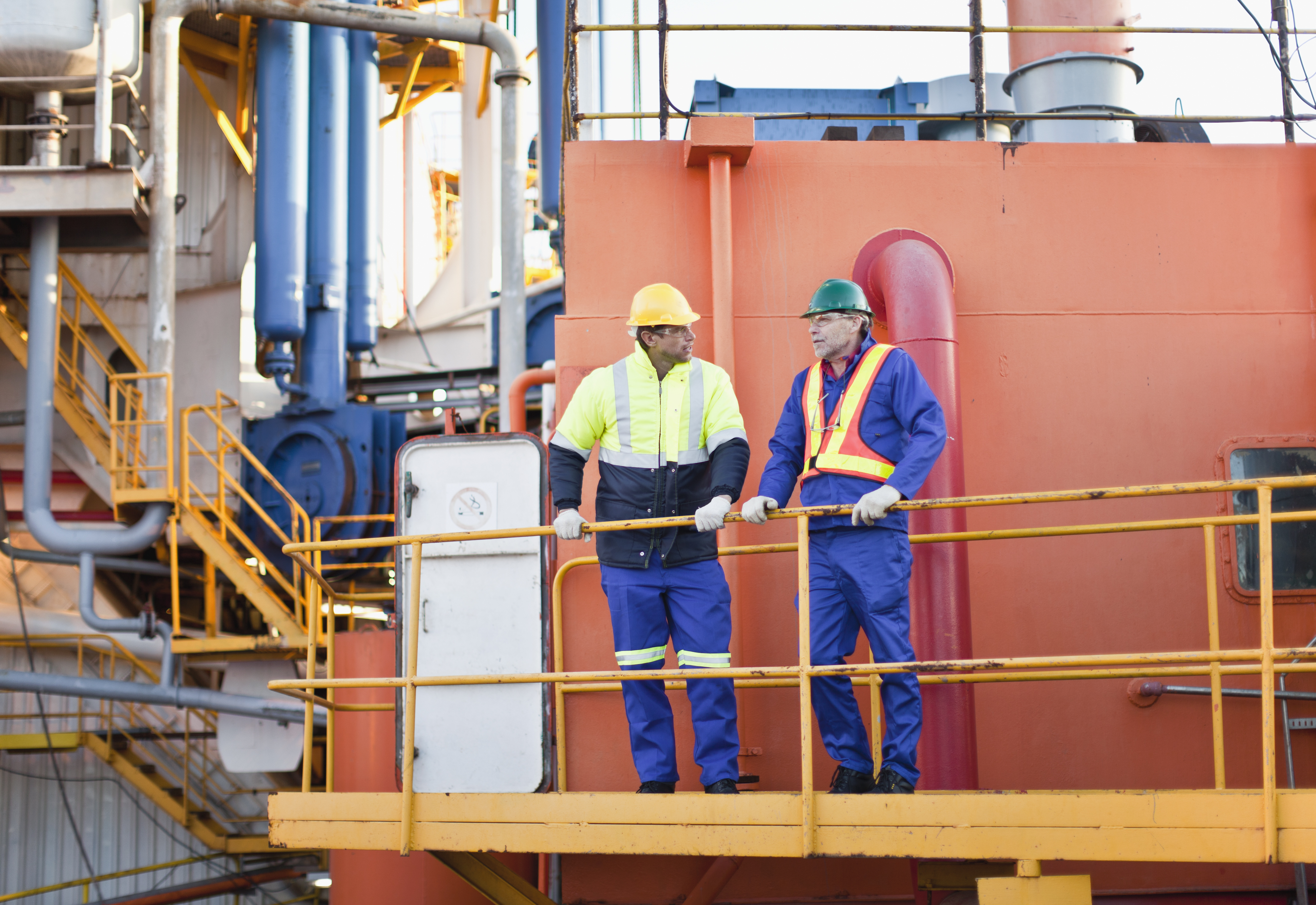 Two men on an oil rig